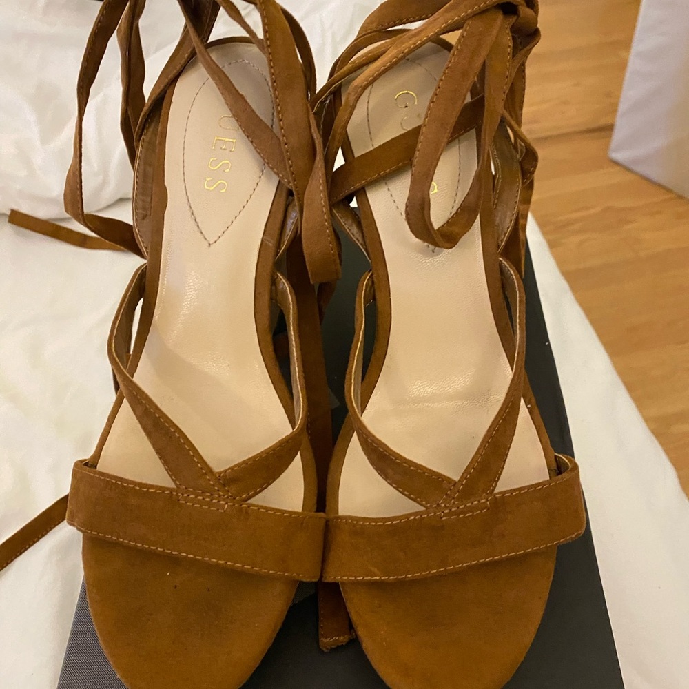 Uec  guess brand steeply wedge sandals. They lace up your leg. 4 inch wedge.